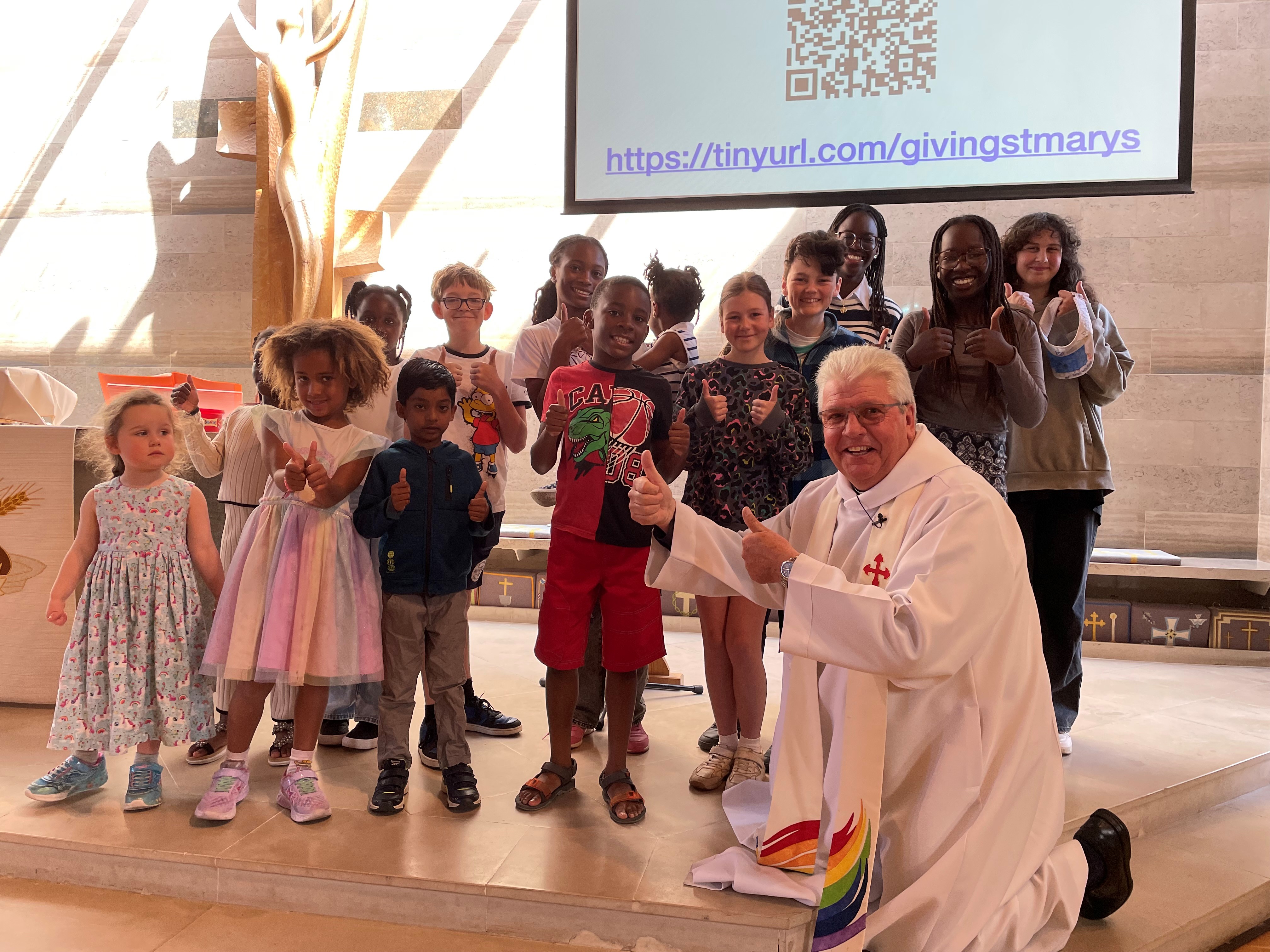Revd Michael Moore with children from St Marys