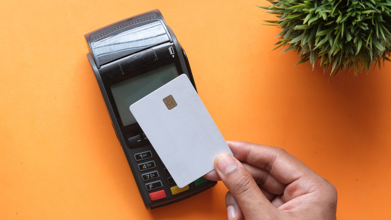 Card reader with a person holding a bank card