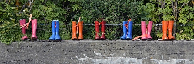 Wellies in a row on a wall