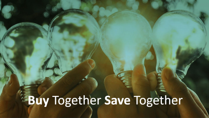Holding lightbulbs with, 'Buy Together Save Together' written on.