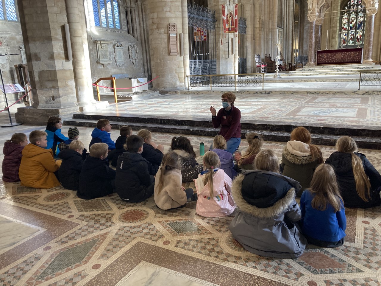 Children sat in the Cathedral learning